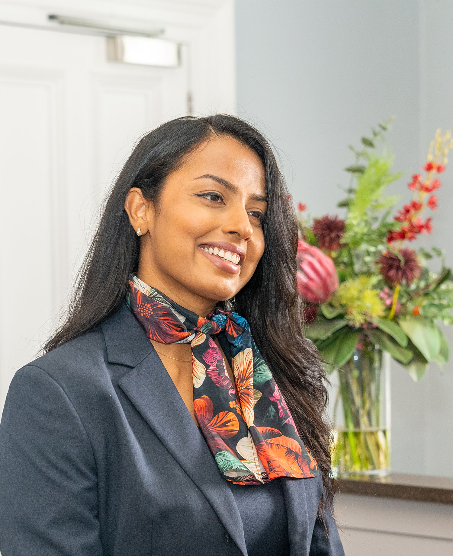 Welcoming advisor smiles at customer 